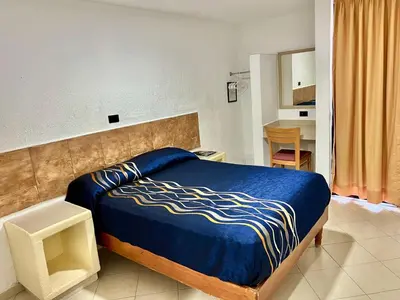 Cama o camas de una habitación en HOTEL SALVADOR