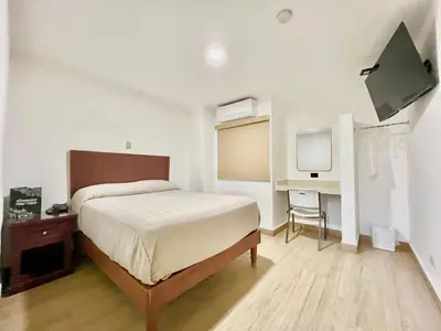 Cama o camas de una habitación en HOTEL SALVADOR
