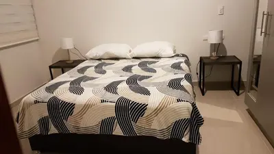 Cama o camas de una habitación en Departamento a dos cuadras de la playa