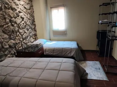 Cama o camas de una habitación en casa consulado