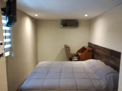 Cama o camas de una habitación en casa consulado