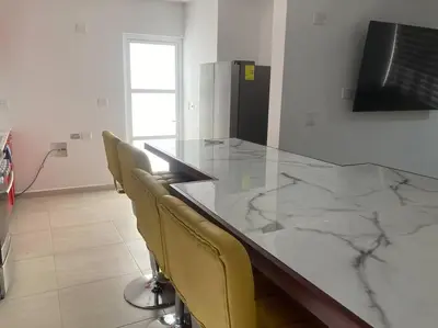 Una televisión o centro de entretenimiento en Sexy Casa 12 Alberca Templada Playa