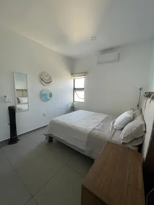 Cama o camas de una habitación en El Departamento Playa Sur