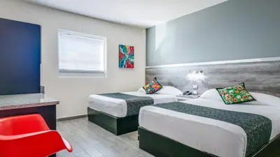Cama o camas de una habitación en Homesuites Rotarismo