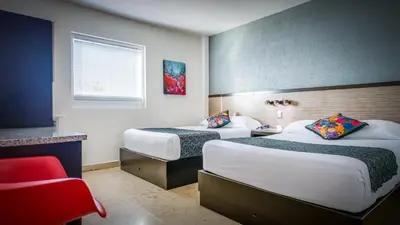 Cama o camas de una habitación en Homesuites Rotarismo