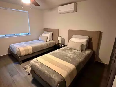 Cama o camas de una habitación en Hermosa y cómoda casa
