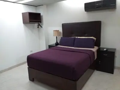 Cama o camas de una habitación en Premier Hotel Suites