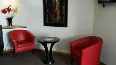 Zona de estar de Premier Hotel Suites