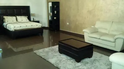 Cama o camas de una habitación en Premier Hotel Suites