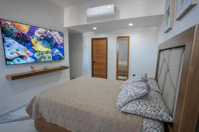 Cama o camas de una habitación en Mazatlán departamento por malecon