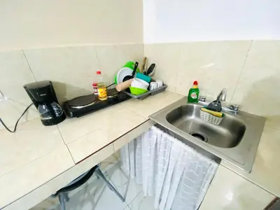 Una cocina o zona de cocina en Departamento Piso 3