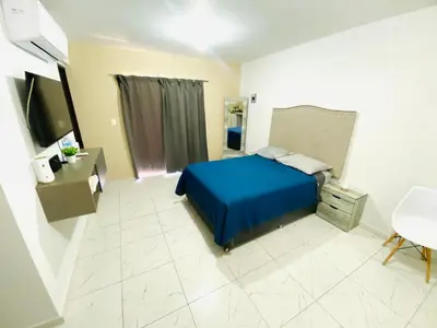 Una televisión o centro de entretenimiento en Departamento Piso 3