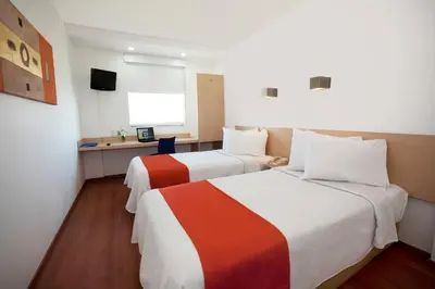 Cama o camas de una habitación en One Saltillo Derramadero