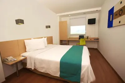 Cama o camas de una habitación en One Saltillo Derramadero