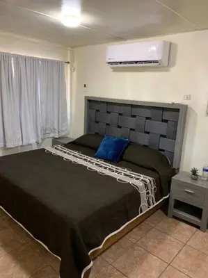 Cama o camas de una habitación en Casa del Carmen, hermoso departamento en Loreto