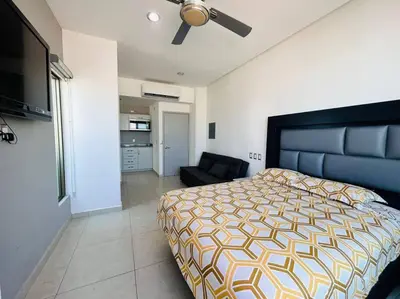 Cama o camas de una habitación en A pie de playa con hermosas vistas by G P S rentas