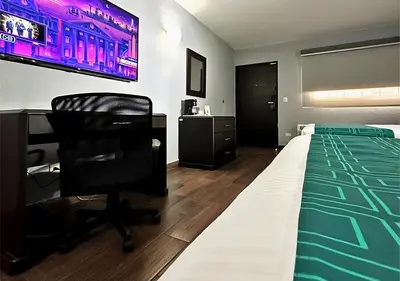 Cama o camas de una habitación en InHouse Hotel Obregón