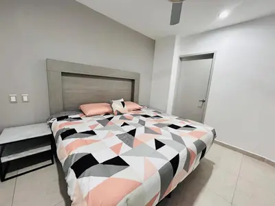 Cama o camas de una habitación en a pie de playa con vista al mar by G P S rentas