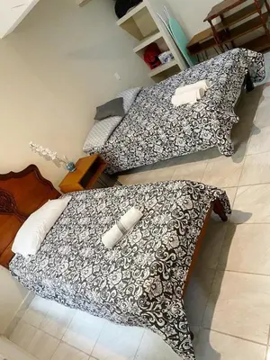 Cama o camas de una habitación en Casa Familiar Chocolate - Olímpica - 5 Min del Malecón