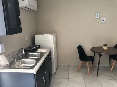 Una cocina o zona de cocina en Olímpica - Room Plata - 5 Min Malecón