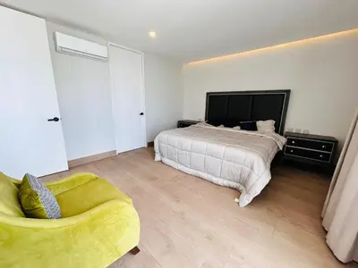Cama o camas de una habitación en En el malecón con vistas al lago y mar by G P S rentas