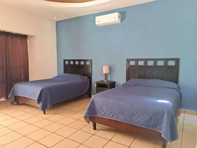 Cama o camas de una habitación en La Ilusión Hotel Campestre y Balneario