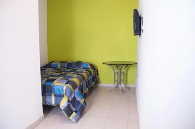 Cama o camas de una habitación en Hotel Bugambilias