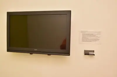 Una televisión o centro de entretenimiento en Hotel Bugambilias