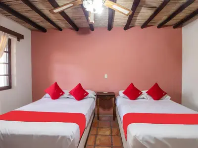 Cama o camas de una habitación en Hacienda Del Angel