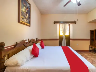 Cama o camas de una habitación en Hacienda Del Angel