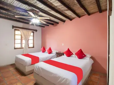 Cama o camas de una habitación en Hacienda Del Angel