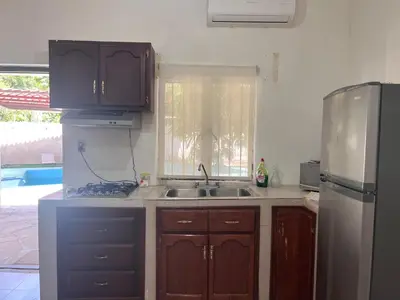 Una cocina o zona de cocina en Flores Condominios Depa Rosa
