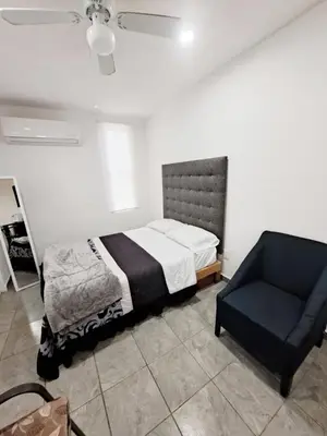 Cama o camas de una habitación en Blanco Armonía - Depto 1 - 2 Min Malecón
