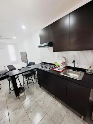 Una cocina o zona de cocina en Blanco Armonía - Depto 1 - 2 Min Malecón