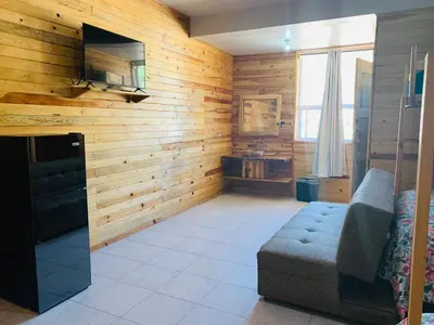 Una televisión o centro de entretenimiento en Rimusa Inn