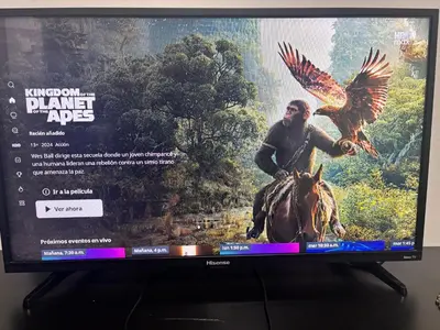 Una televisión o centro de entretenimiento en Casa amplia