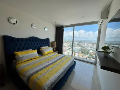 Cama o camas de una habitación en Hermoso Departamento a pie de playa en CAM