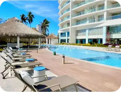 Piscina en o cerca de Hermoso Departamento a pie de playa en CAM