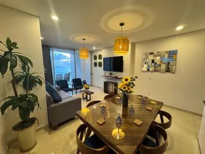 Zona de estar de Hermoso Departamento a pie de playa en CAM