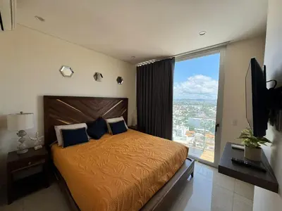 Cama o camas de una habitación en Hermoso Departamento a pie de playa en CAM