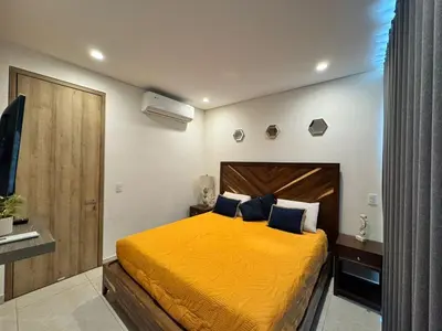 Cama o camas de una habitación en Hermoso Departamento a pie de playa en CAM