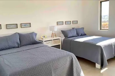 Cama o camas de una habitación en CASA SAHUARO con alberca privada, Col El Mirador