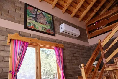 Una televisión o centro de entretenimiento en Grand Mountain Cabañas Creel