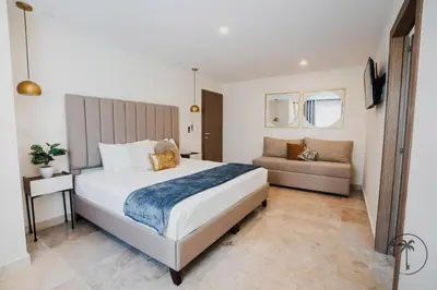 Cama o camas de una habitación en Nice apartment with a pool and gym in Mazatlán
