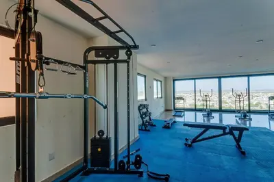 Gimnasio o instalaciones de fitness de Nice apartment with a pool and gym in Mazatlán