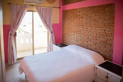 Cama o camas de una habitación en Garimar Condominios en San Carlos