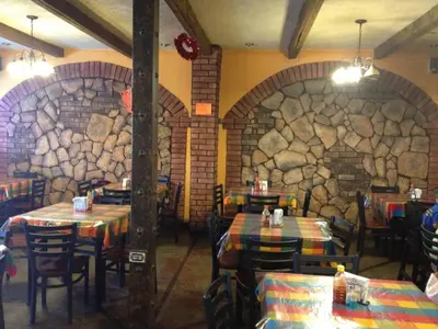 Un restaurante o sitio para comer en Hotel Olivia