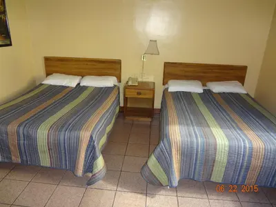 Cama o camas de una habitación en Hotel Olivia