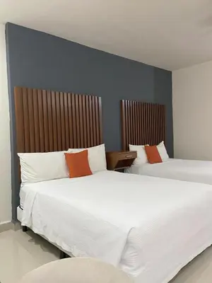 Cama o camas de una habitación en Hotel NUVE EXPRESS