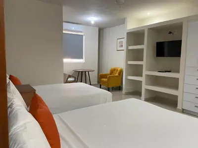 Cama o camas de una habitación en Hotel NUVE EXPRESS